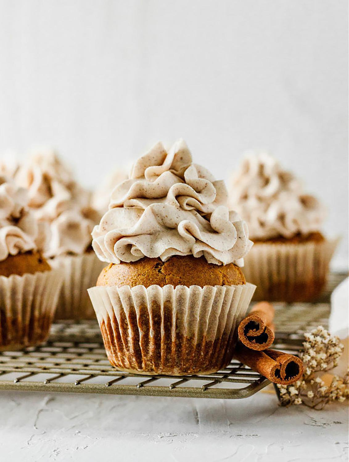 Cupcake topped with a large swirl of frosting