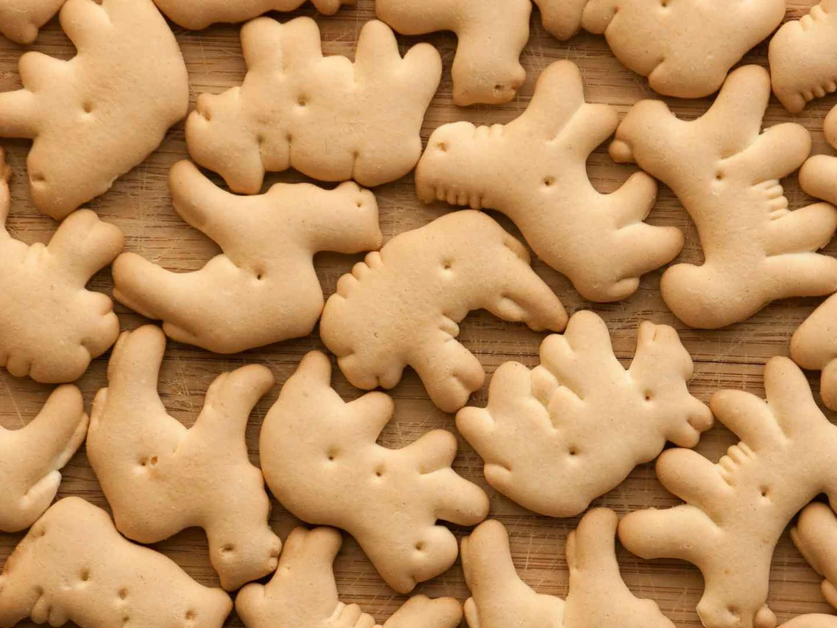 Animal-shaped beige crackers overlap across the entire frame.
