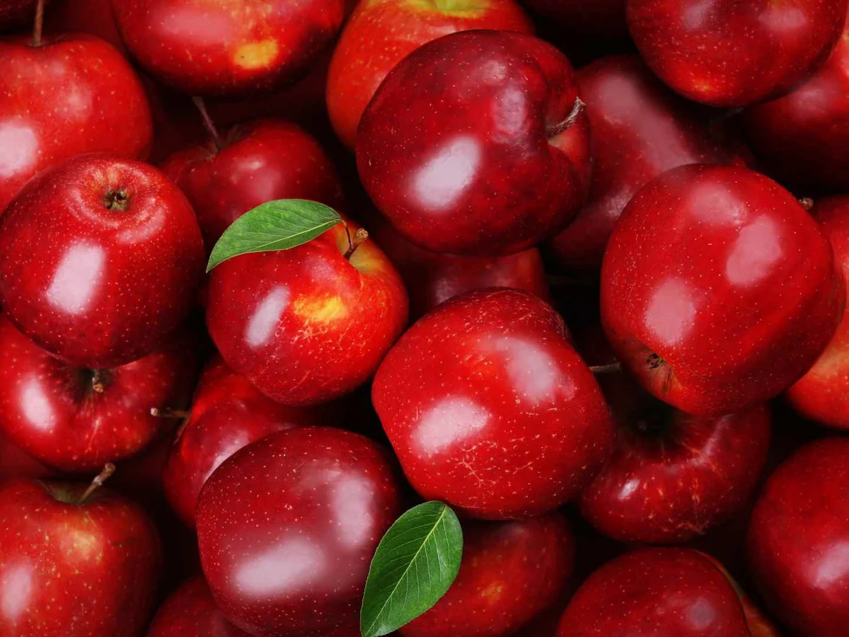 Whole red apples filling the frame
