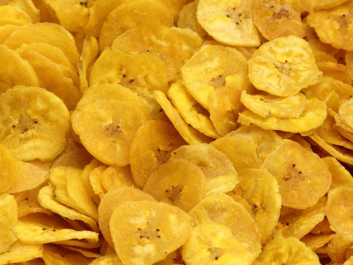 Golden banana chips fill the entire frame.
