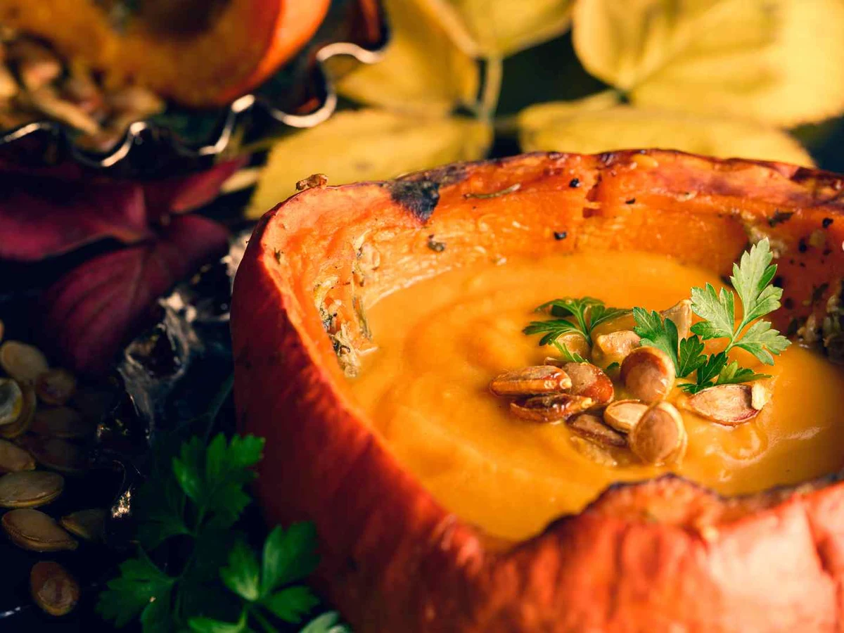 Roasted butternut squash served inside a hollowed squash half.