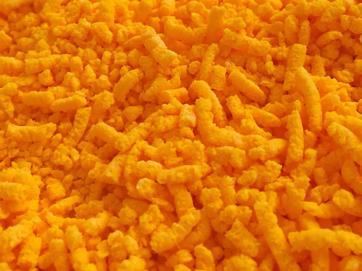 A close field of orange cheese snacks