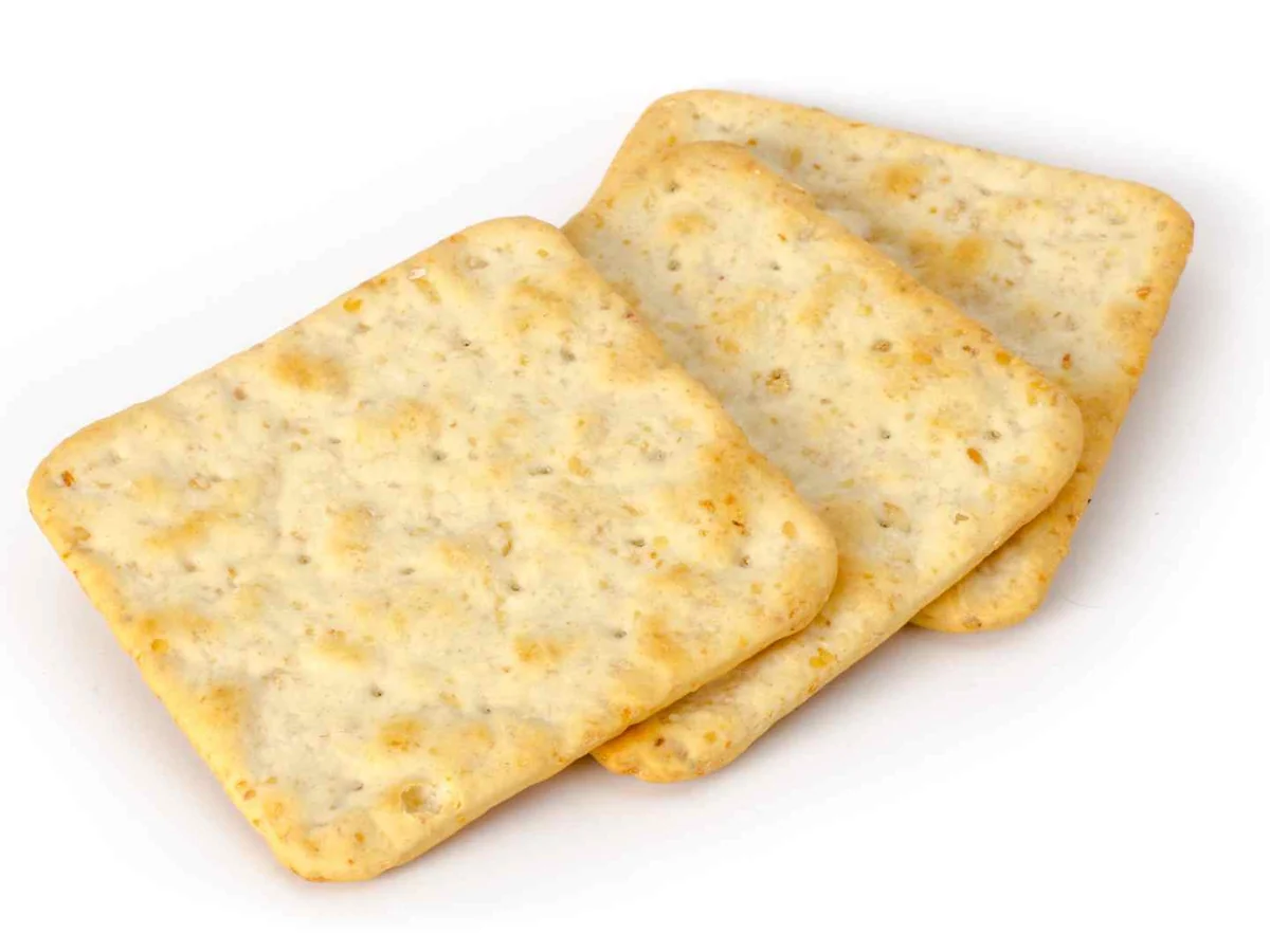 Three pale square crackers isolated on white