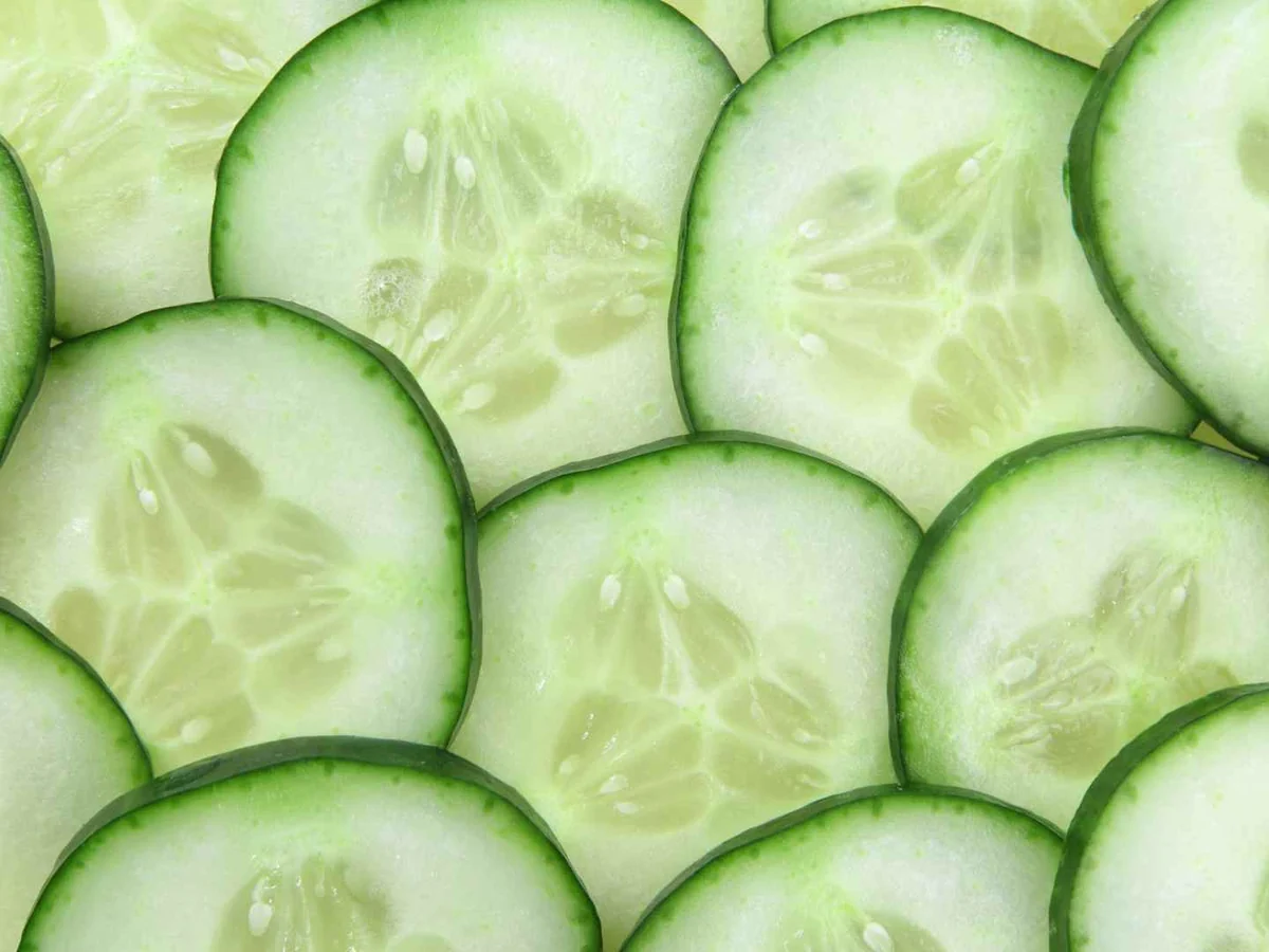 Overlapping cucumber slices filling the frame