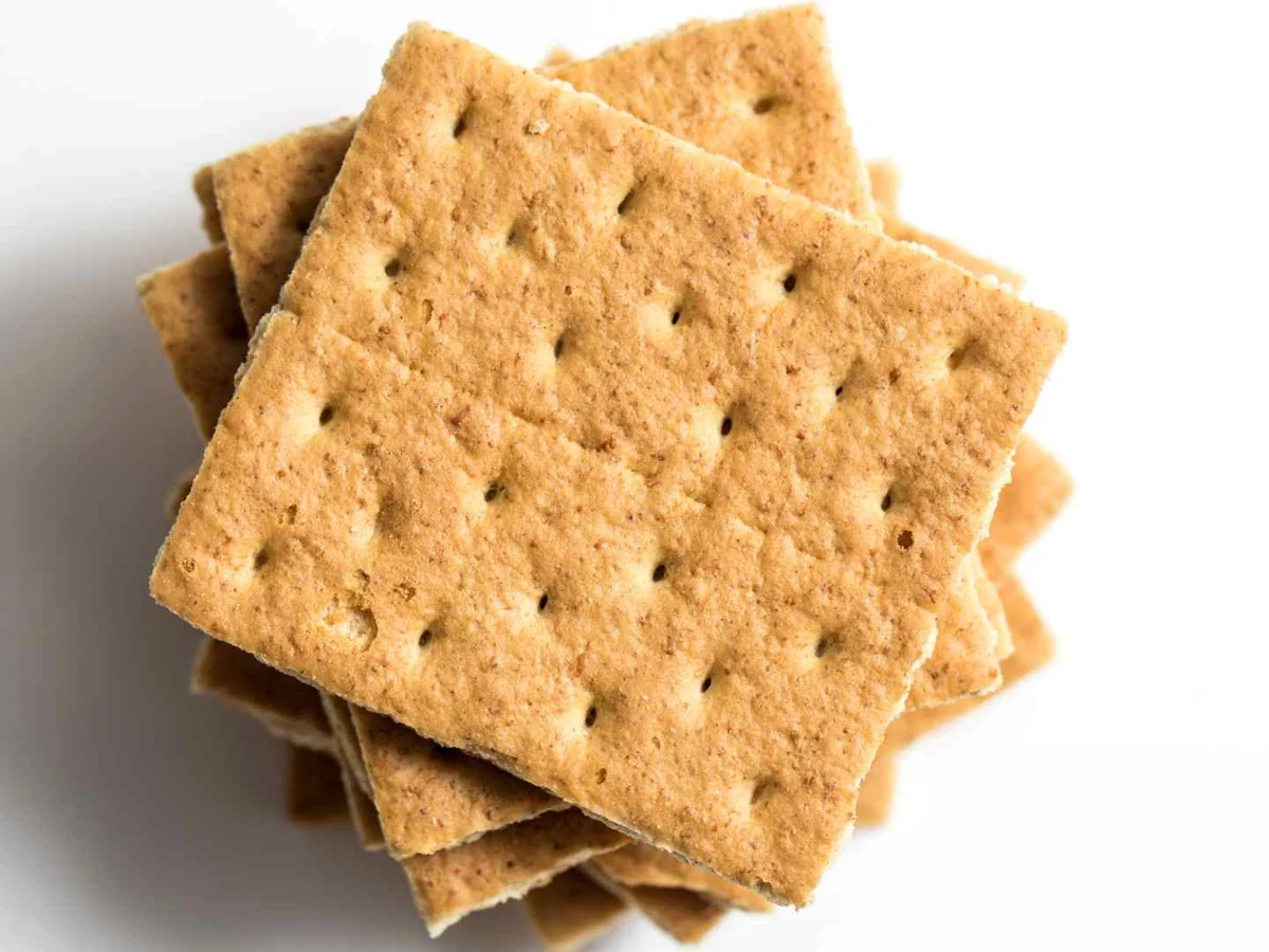 A small stack of square graham crackers on white