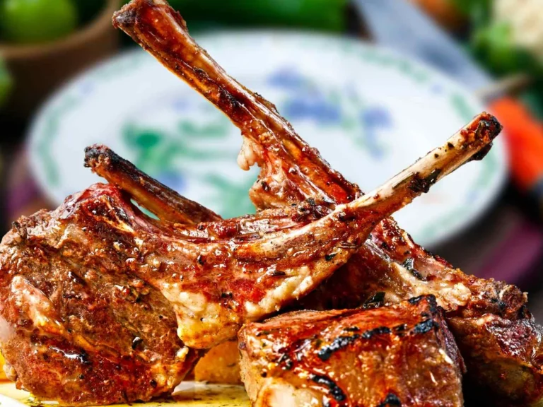 Three grilled lamb chops on a plate