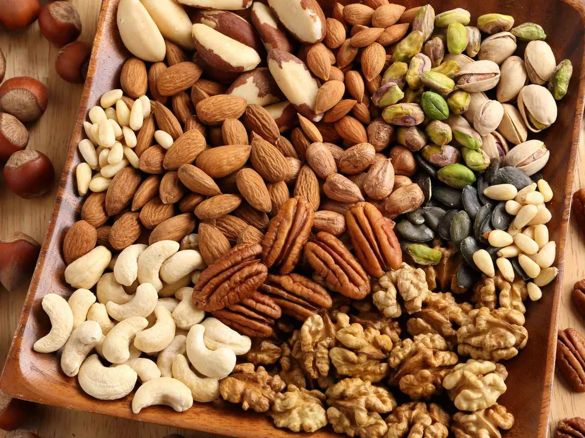 An assortment of walnuts, pecans, almonds, pistachios, cashews, and hazelnuts