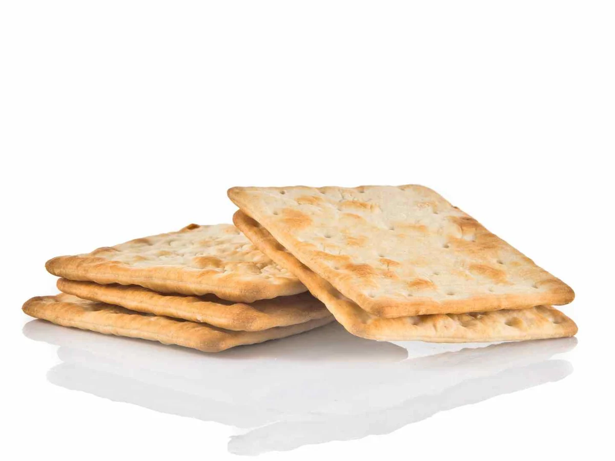 A short stack of square crackers isolated on white