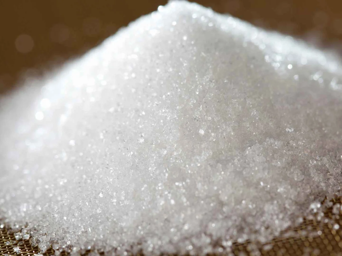A close mound of white granulated sugar