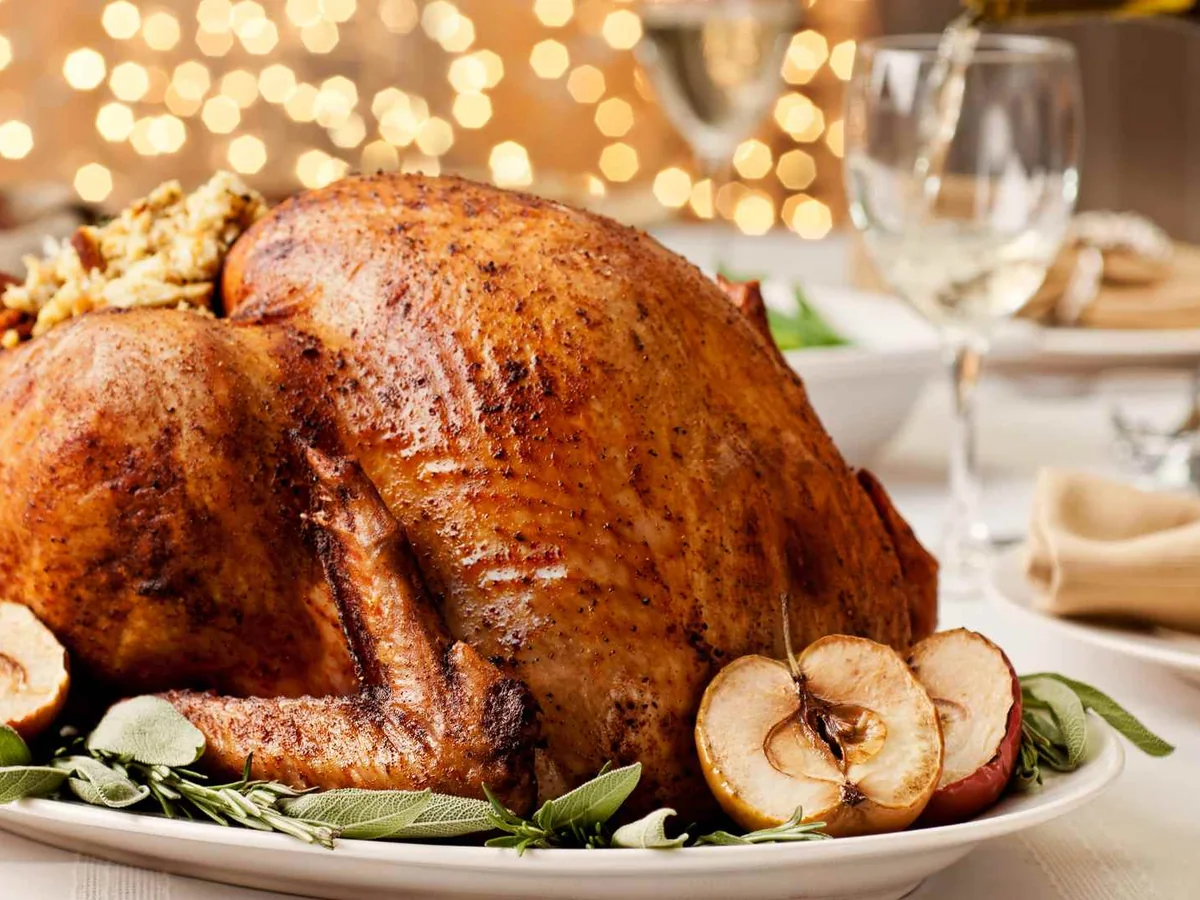 A whole roasted turkey on a holiday table