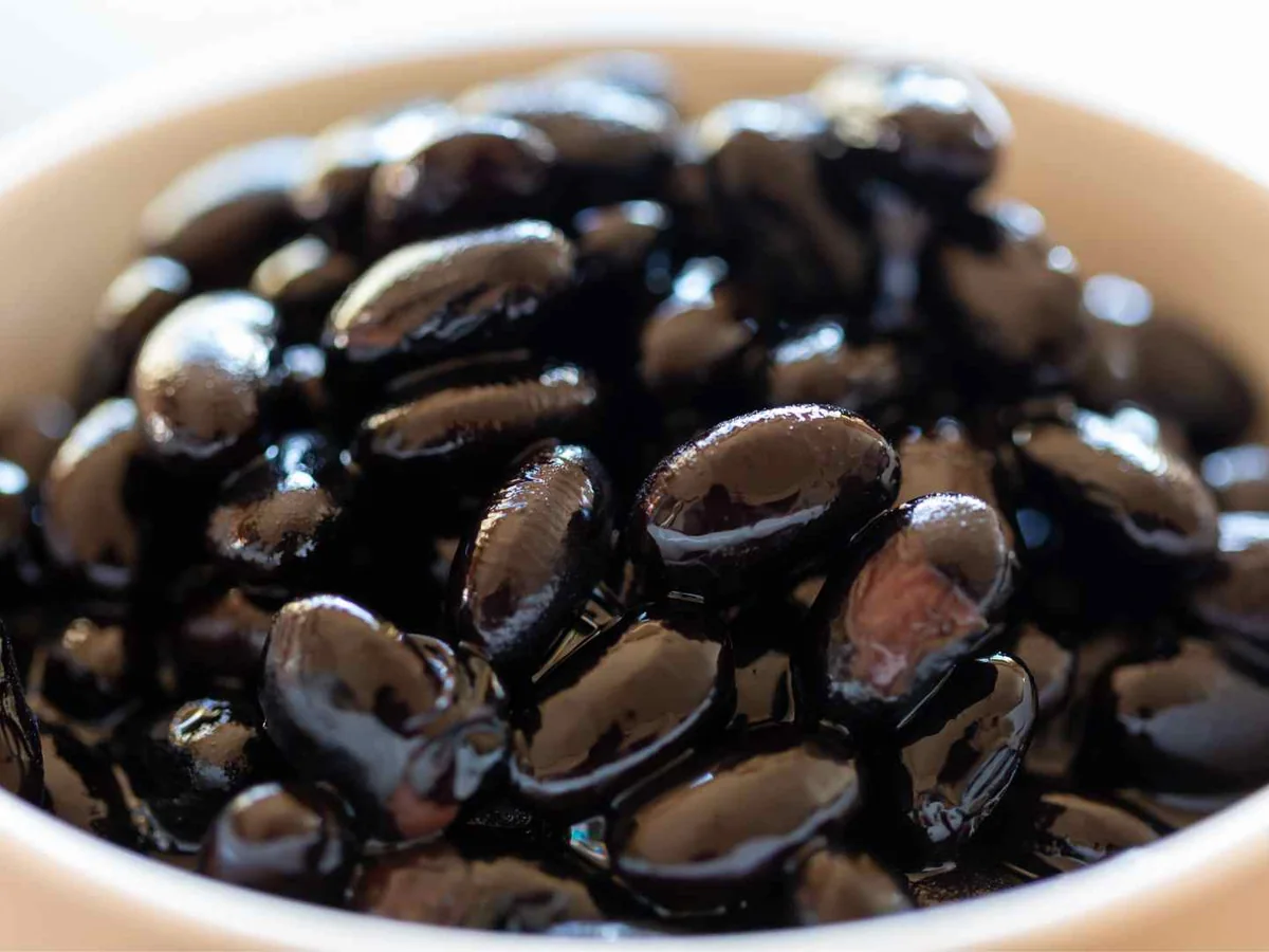 Cooked black beans in a white bowl