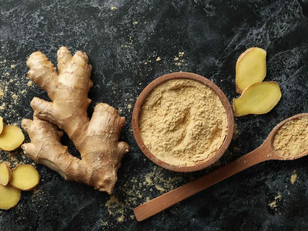 Ginger roots, slices, powder, and a cinnamon stick