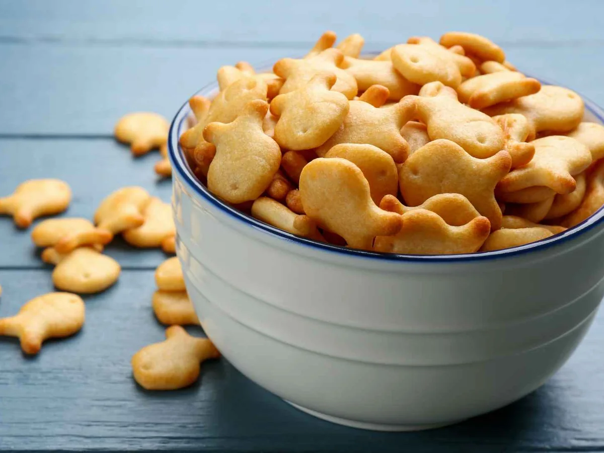 Fish-shaped cheese crackers in a blue bowl