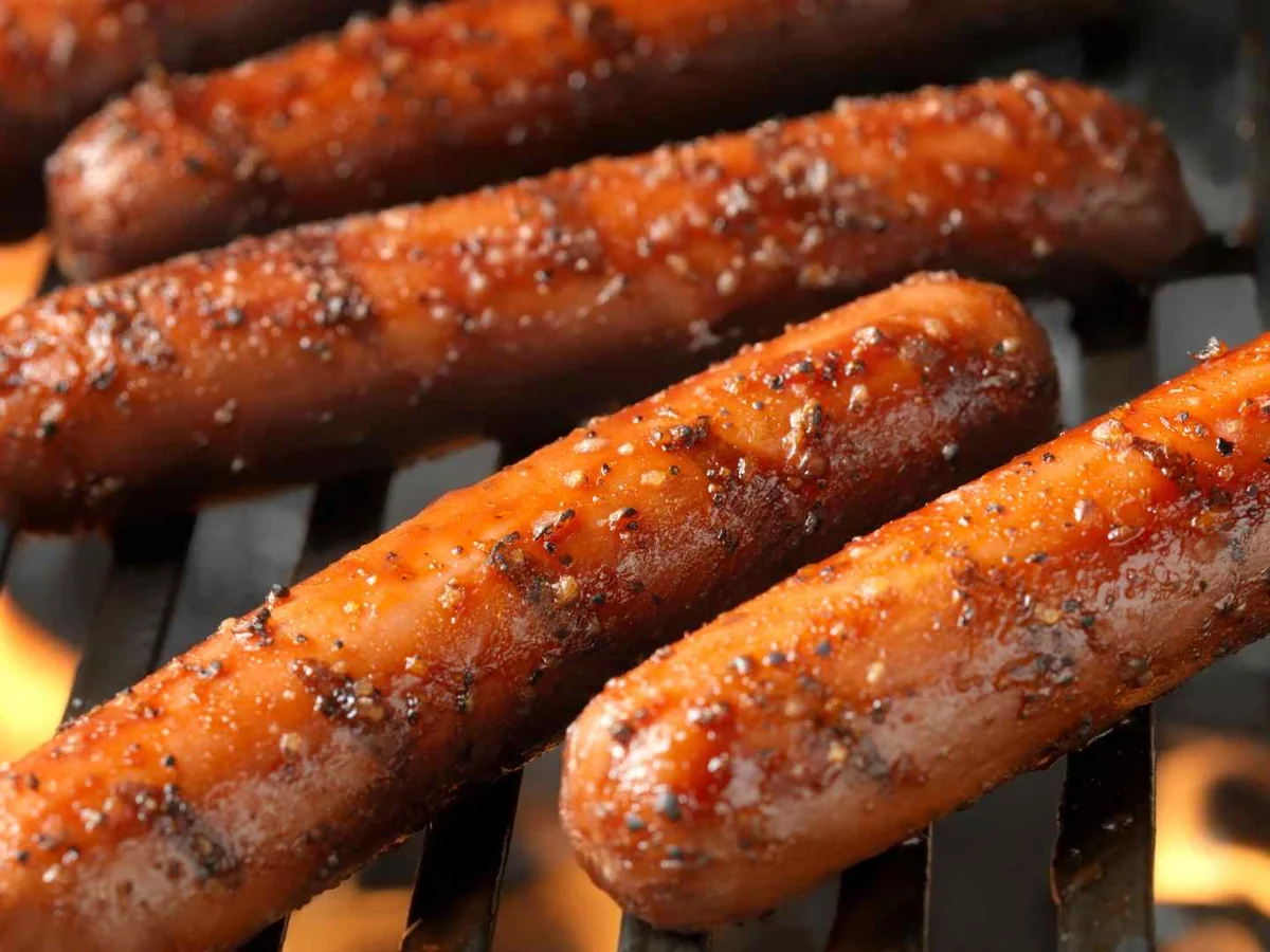 Sausages cooking on a grill