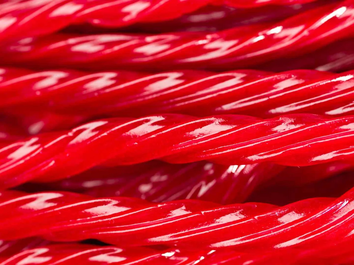 Close-up of glossy red licorice twists
