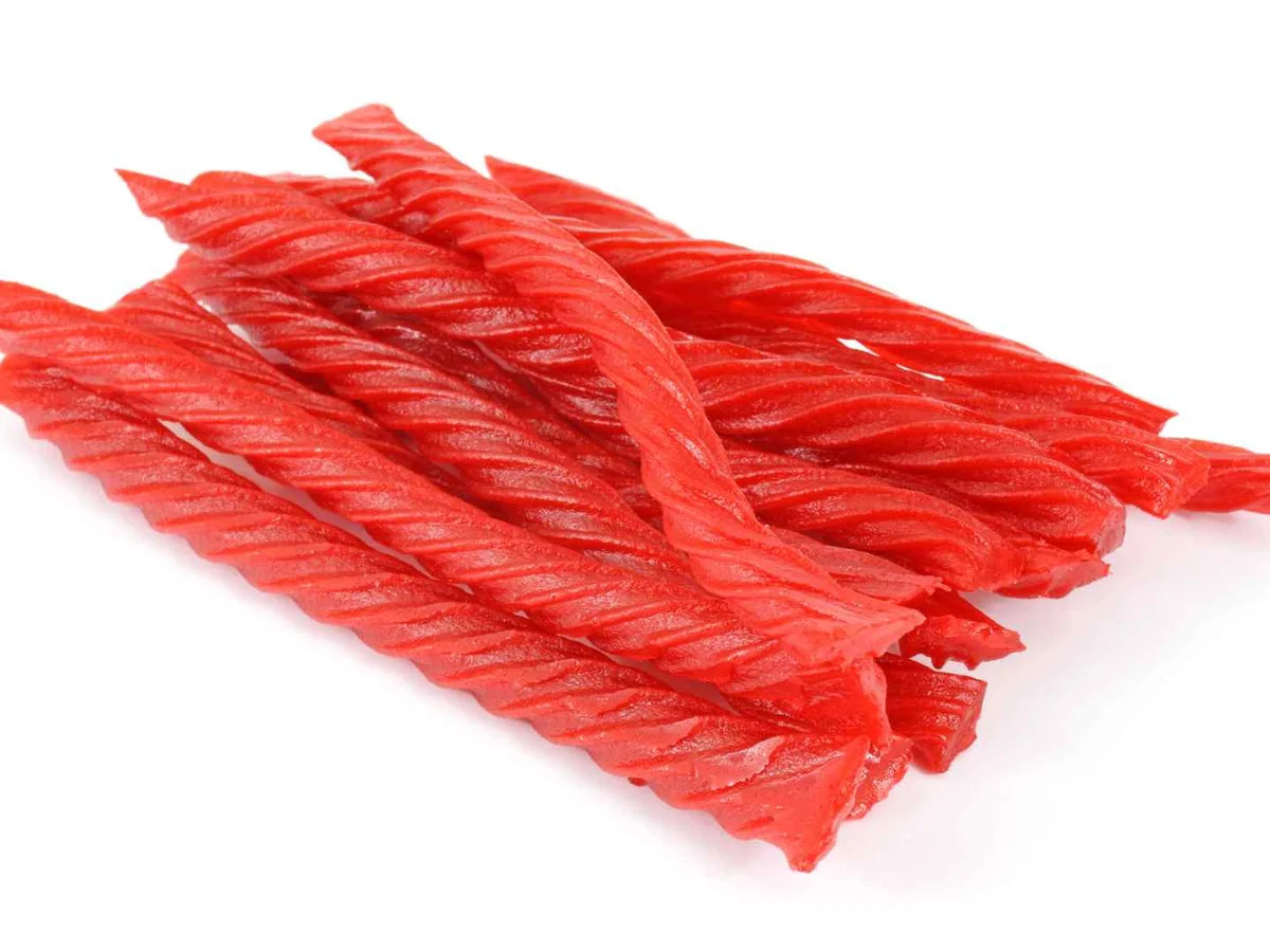 A small pile of red twisted licorice sticks