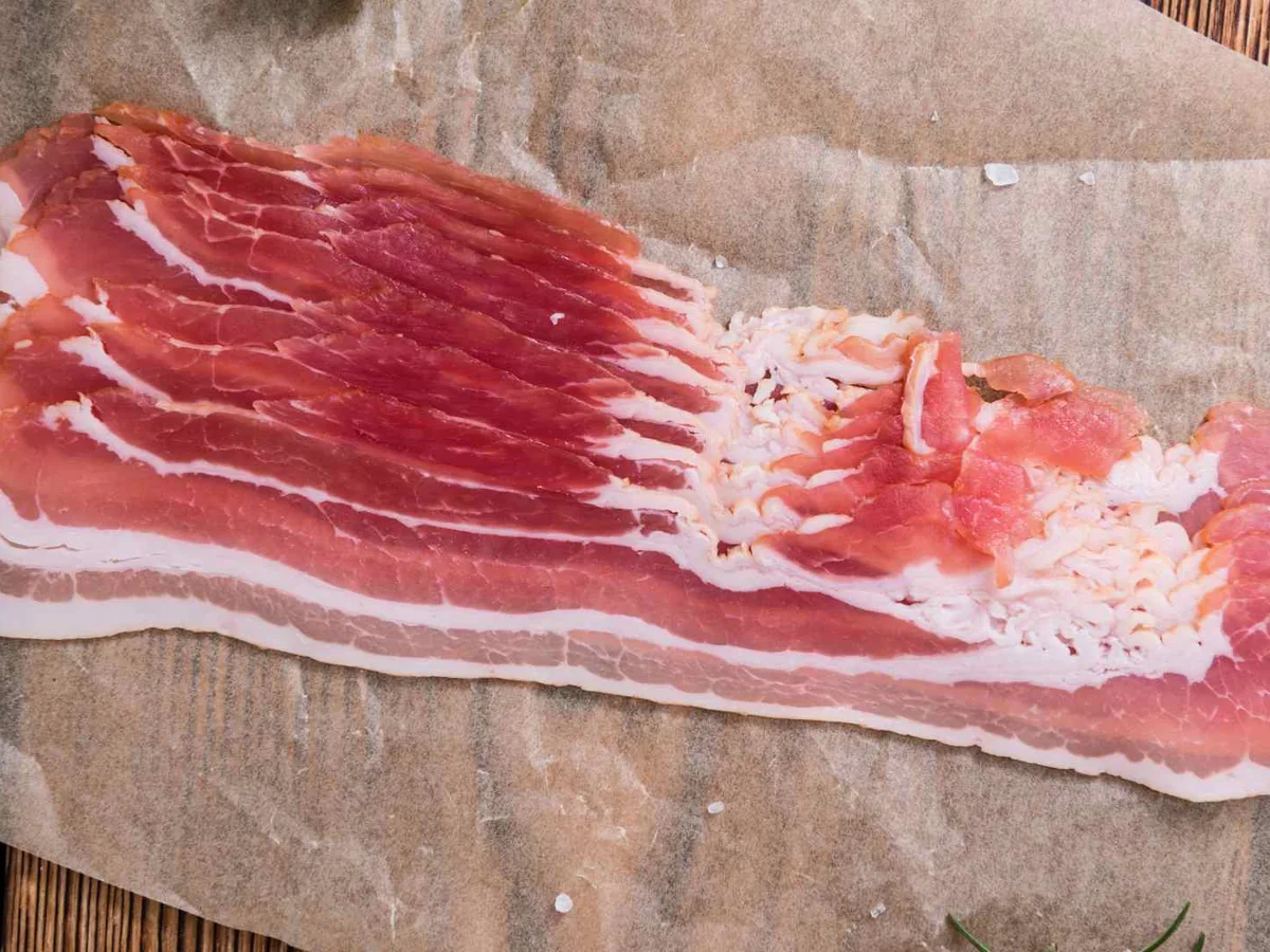 Raw bacon strips on butcher paper