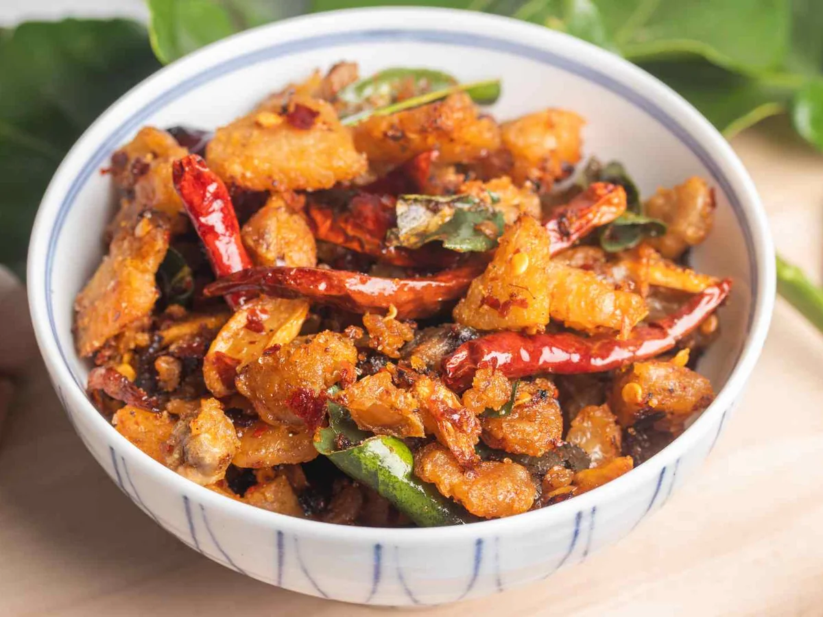 A bowl of spicy stir-fried vegetables and meat