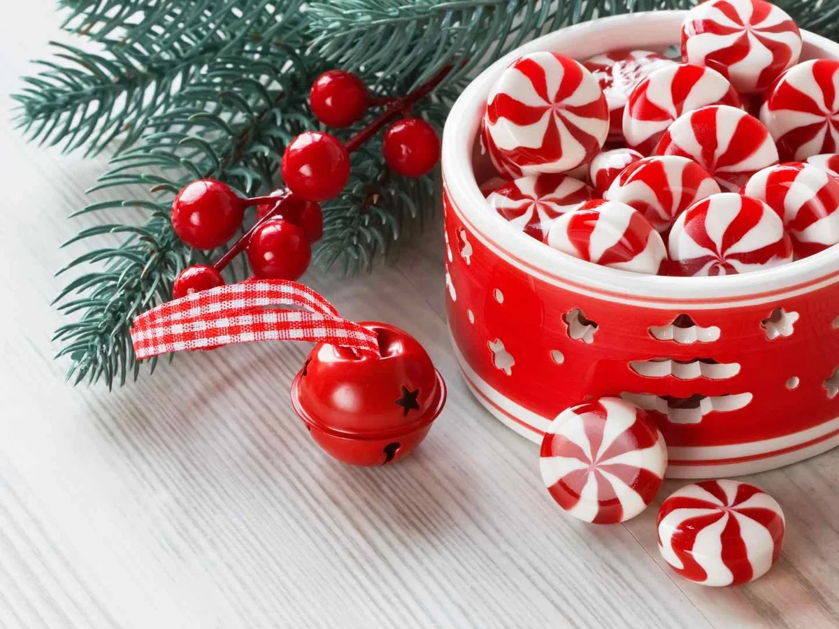Red-and-white peppermint candies in a festive bowl